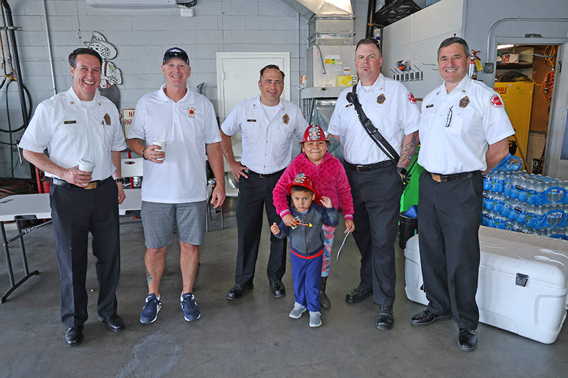 Fire department staff with children